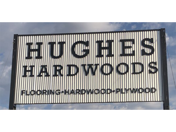 storefront sign for Hughes Hardwoods in CA